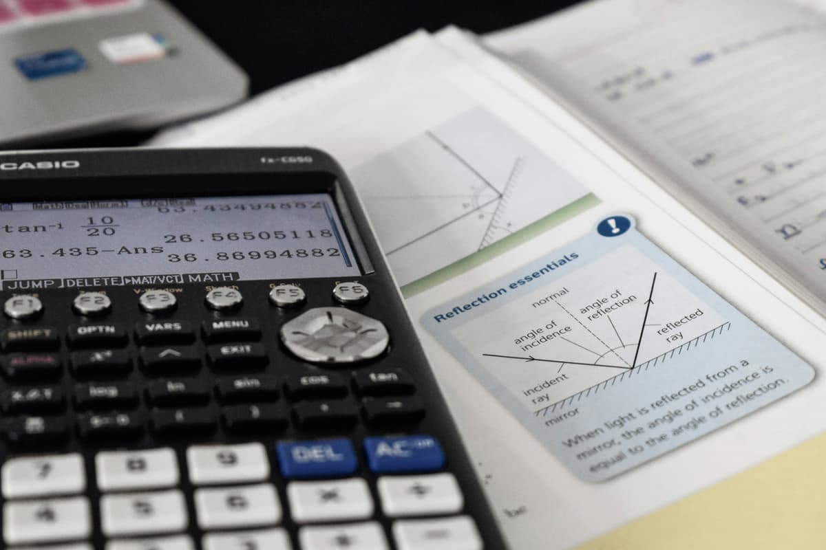 Professional finance workspace with financial documents and calculations